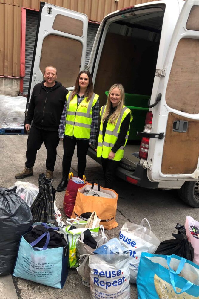 Nikita and Georgia with bags of clothes